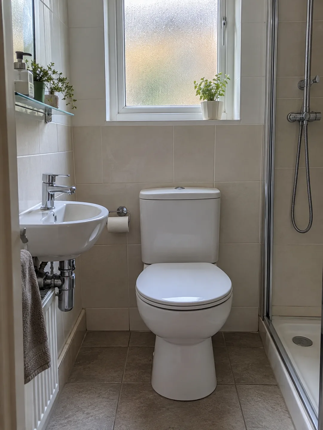 Illustration of a bathroom basin, toilet and shower